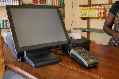 POS terminal and receipt printer on a shop counter